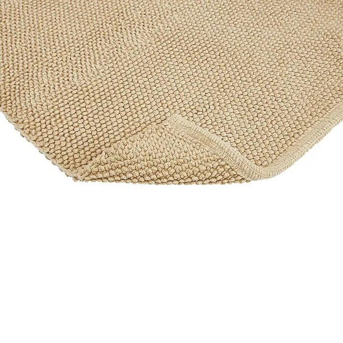 Badteppich Atlanta - 60 x 100 cm, Beige, 100% Baumwolle - Nahaufnahme einer beigen Badematte, die ihre weiche Textur und hochwertige Verarbeitung zeigt. Perfekt für ein stilvolles Badezimmer.