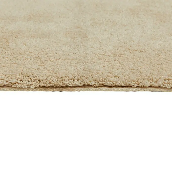 Badteppich Ibiza - 50 x 80 cm, Beige, 100% Baumwolle - Nahaufnahme eines beigen Teppichs, der Textur und Weichheit betont. Ideal für gemütliche Innenräume.