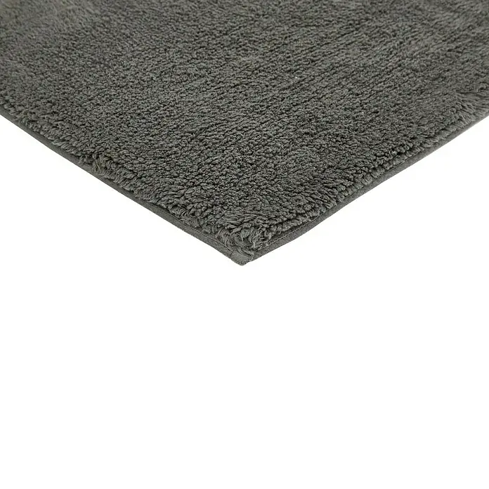 Badteppich Ibiza - 60 x 100 cm, Anthrazit, 100% Baumwolle - Nahaufnahme eines grauen, flauschigen Badteppichs. Ideal für ein luxuriöses Badezimmerambiente und angenehm weich unter den Füßen.