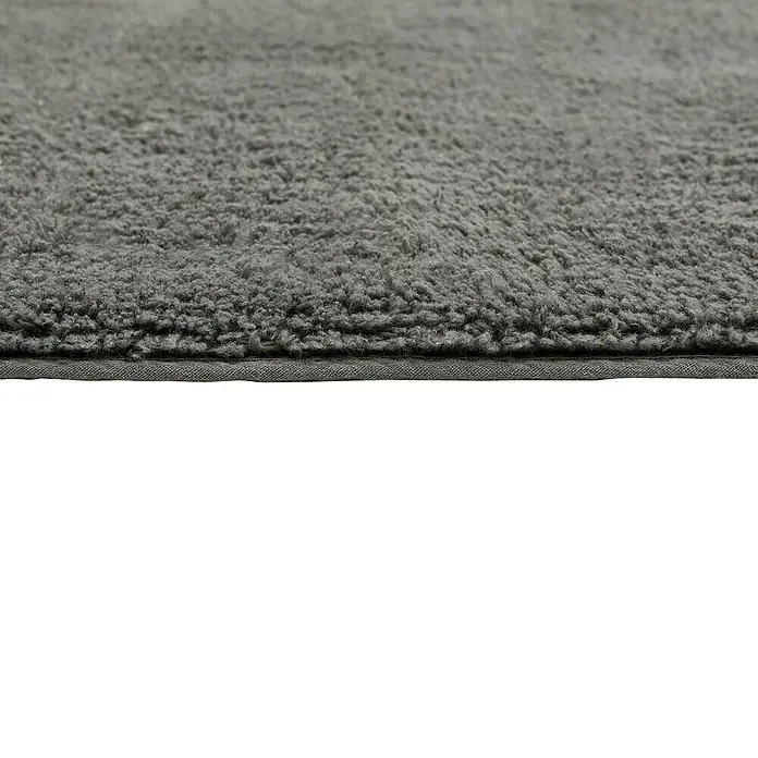 Badteppich Ibiza - 60 x 100 cm, Anthrazit, 100% Baumwolle - Nahaufnahme eines grauen Badteppichs mit flauschiger Oberfläche und einem schlichten, aber robusten Rand.