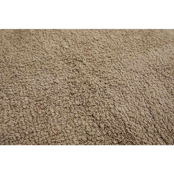 Badteppich Ibiza - 60 x 100 cm, Taupe, 100% Baumwolle - Nahaufnahme eines beigefarbenen Shaggy-Teppichs, der eine weiche, flauschige Textur und ein einheitliches Farbschema aufweist.