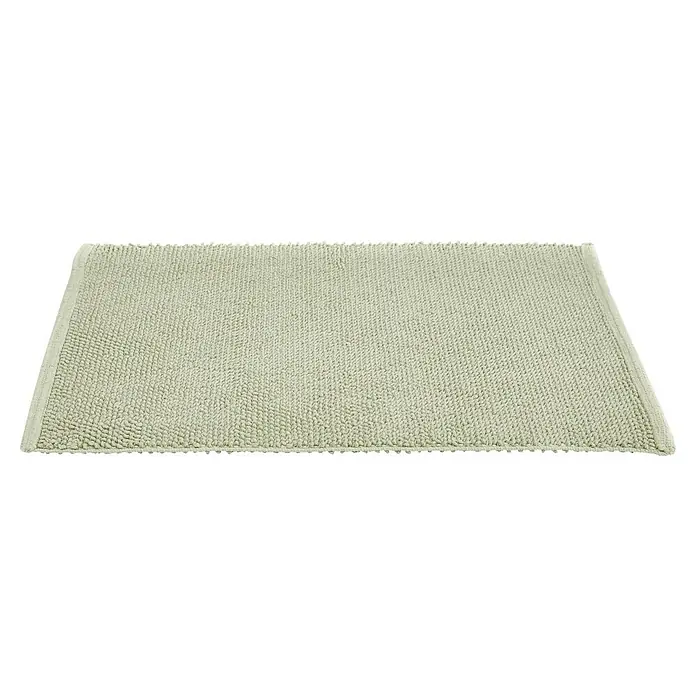 Badteppich Atlanta - 60 x 100 cm, Salbei, 100% Baumwolle - Nahaufnahme eines rechteckigen, hellgrünen Badvorlegers mit gewebter Textur und sauberer Umrandung, ideal für Badezimmer.