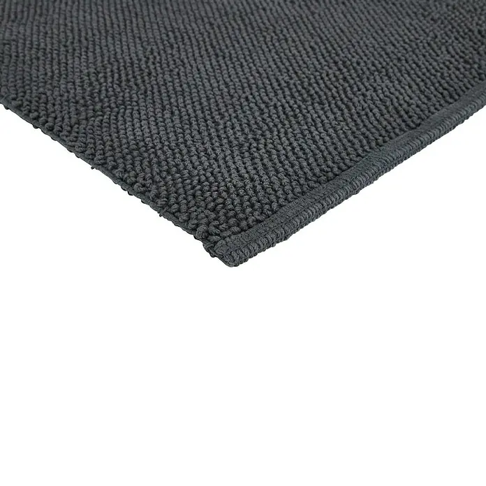 Badteppich Atlanta - 60 x 100 cm, Anthrazit, 100% Baumwolle - Nahaufnahme eines grauen, getufteten Badvorlegers mit schmaler Bordüre, der Weichheit und Komfort für das Badezimmer verspricht.