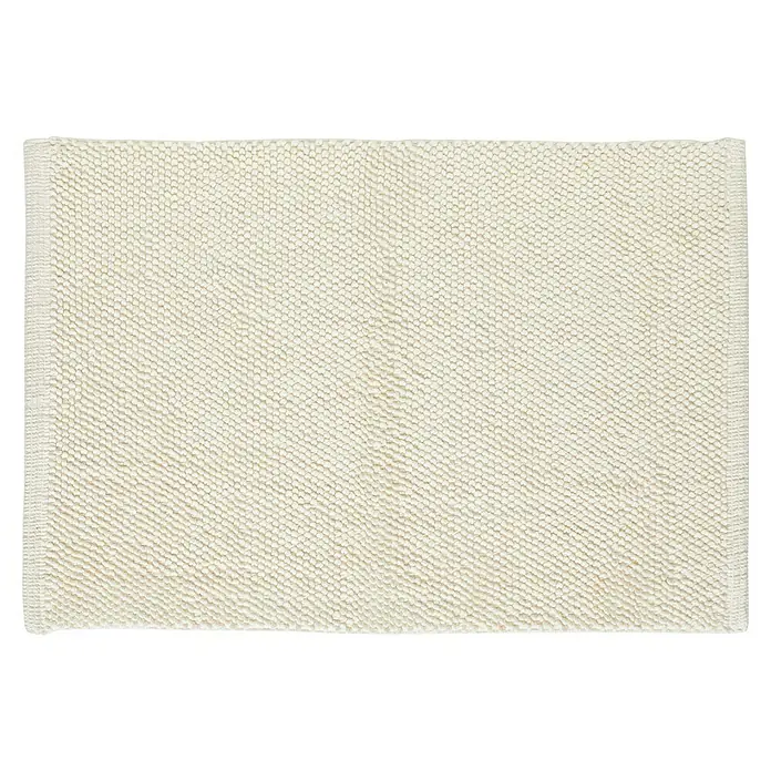 Badteppich Atlanta - 60 x 100 cm, Weiß, 100% Baumwolle - Nahaufnahme eines quadratischen, cremefarbenen Teppichs mit dichter Schlingenstruktur, der Wärme und Komfort ausstrahlt.