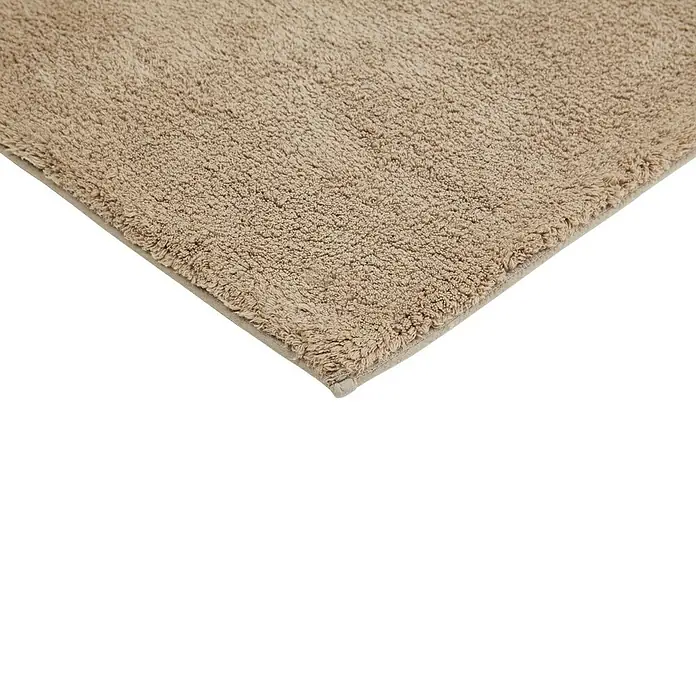 Badteppich Ibiza - 60 x 100 cm, Taupe, 100% Baumwolle - Detailaufnahme eines beigefarbenen Badezimmerteppichs mit weicher Textur, ideal für ein komfortables und stilvolles Badezimmerambiente.