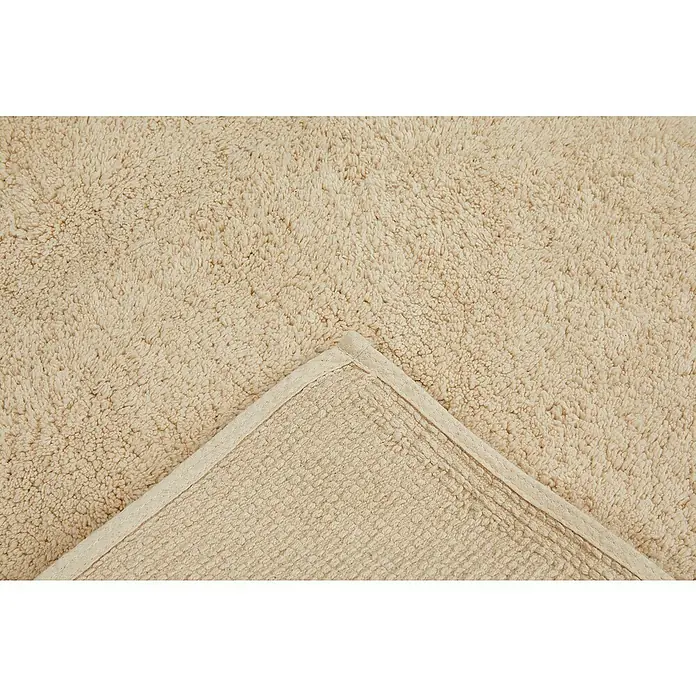 Badteppich Ibiza - 50 x 80 cm, Beige, 100% Baumwolle - Nahaufnahme eines beigen Badteppichs mit Textur, der eine weiche und einladende Oberfläche für Badezimmer bietet.