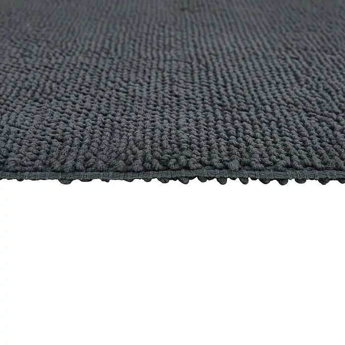 Badteppich Atlanta - 60 x 100 cm, Anthrazit, 100% Baumwolle - Nahaufnahme eines grauen Badteppichs mit dichter, weicher Oberfläche, ideal für Badezimmer. Der Teppich bietet Komfort und Funktionalität.