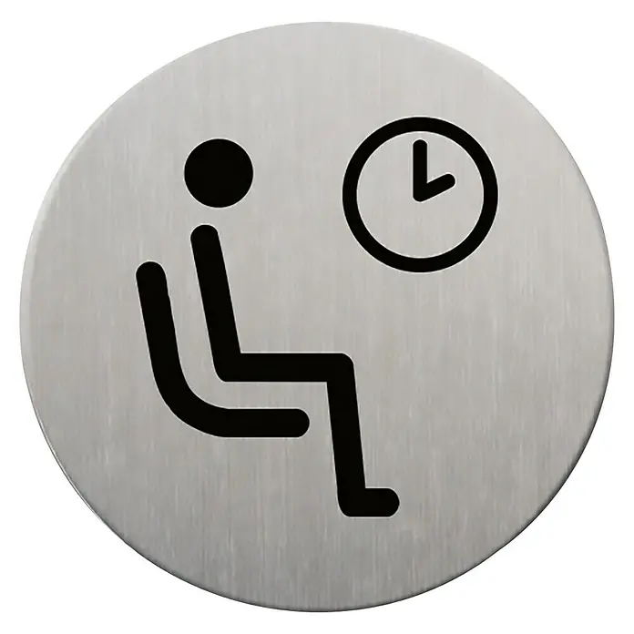 Rótulo - Plateado/Negro, Sala de espera, 9 cm - La imagen muestra una señal de zona de espera en una placa metálica redonda cepillada, con una persona sentada y un reloj.