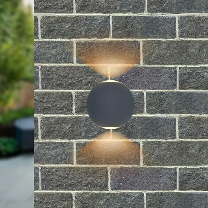 Starlux LED-Außenwandleuchte Two-Eye - 6 W, 10 x 9 x 10,5 cm, Schwarz, IP54 - Runde Wandleuchte aus dunklem Metall mit Lichteffekten an einer Ziegelwand. Perfekt für eine stilvolle Außenbeleuchtung.