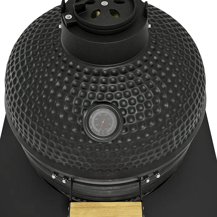Kingstone Cube Holzkohlegrill Kamado - Durchmesser Grillfläche: 38 cm, Schwarz - Detailaufnahme eines schwarzen Keramikgrills mit integriertem Thermometer zur Temperaturkontrolle beim Grillen.