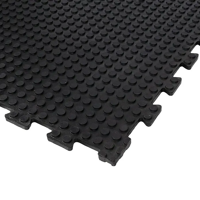 Floordirekt Bodenschutzmatte Puzzle Gummiläufer Buffallo - 100 x 100 cm, Schwarz - Schwarze Gummimatte mit Noppenoberfläche, ideal für Werkstätten oder Fitnessräume, bietet Rutschfestigkeit und einfache Reinigung.