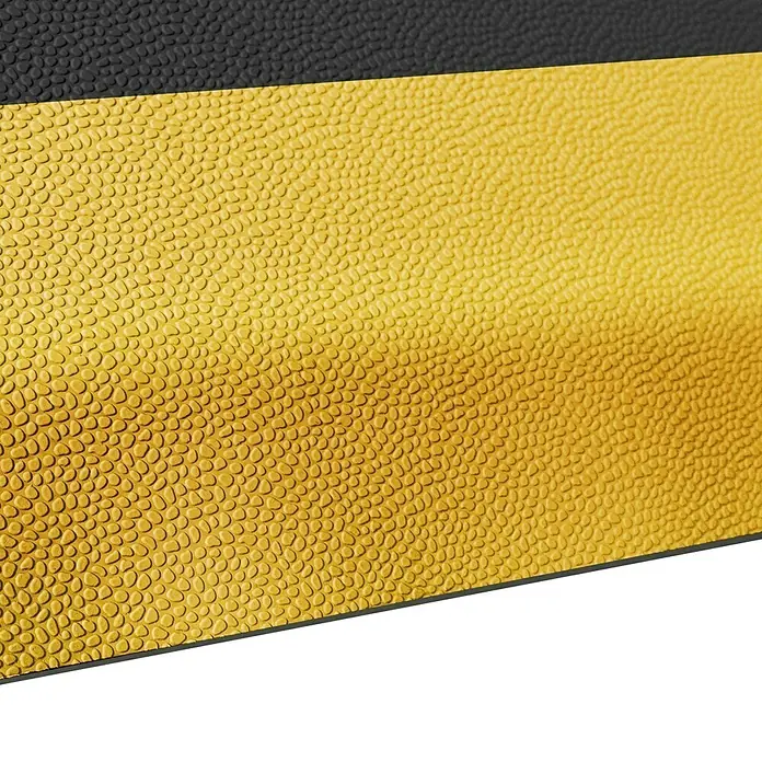 Floordirekt Bodenschutzmatte Soft-Tritt - 120 x 450 cm, Gelb/Schwarz - Nahaufnahme eines Basketballs mit markanter Textur in Gelb- und Schwarztönen. Die Oberfläche weist ein Noppenmuster auf.