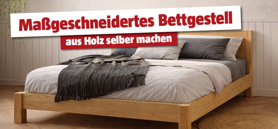 Selbstgemachtes Bettgestell im Schlafzimmer mit Decke und Kissen