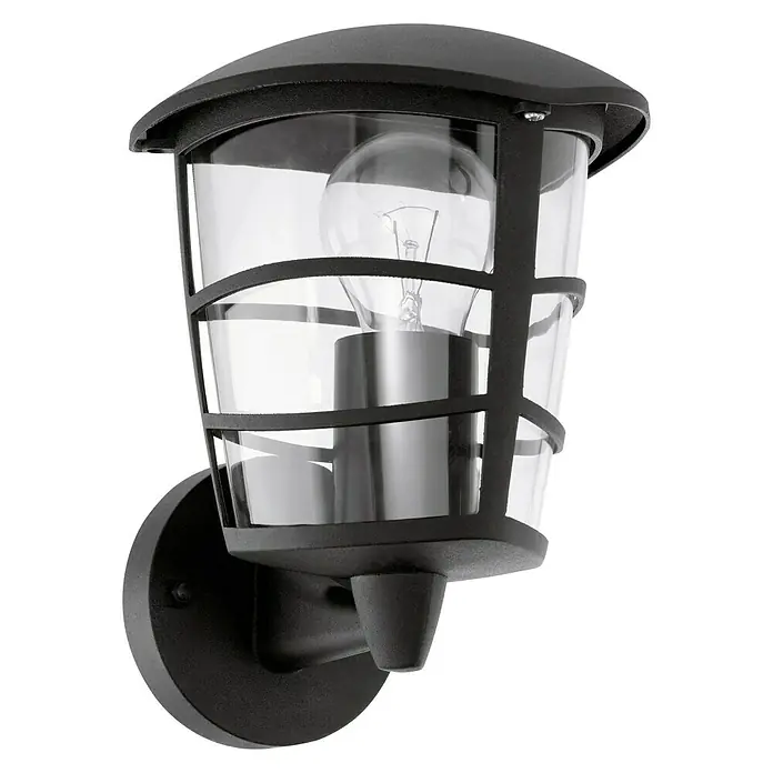 Eglo Aloria Aplique exterior - 60 W, 19 x 17 x 22,5 cm, Negro, IP44, Ascendente - Primer plano de una lámpara de pared exterior negra con pantalla de cristal transparente, que emite un brillo cálido y acogedor, creando un ambiente elegante.