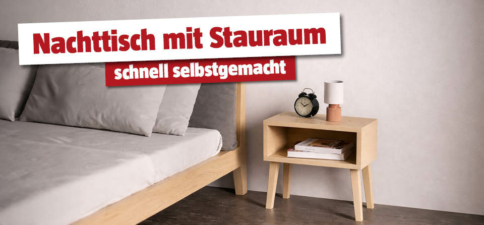 Selbstgemachter Nachttisch aus Holz neben dem Bett