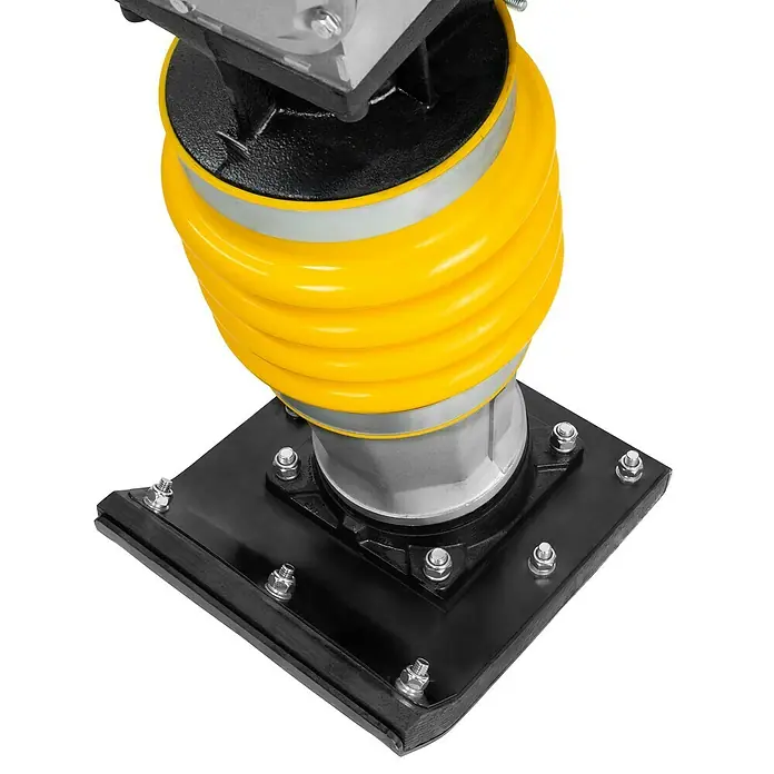 Güde Vibrationsstampfer GVS 80E - Max. Vorwärtsgeschwindigkeit: 10 m/min, Maße Stampfplatte: 340 x 280 mm, Verdichtungstiefe: 65 cm, Motorleistung: 4,1 kW - Detailansicht eines gelben Stampffußes für Bodenverdichtung mit schwarzer Basis und silbernen Befestigungselementen.
