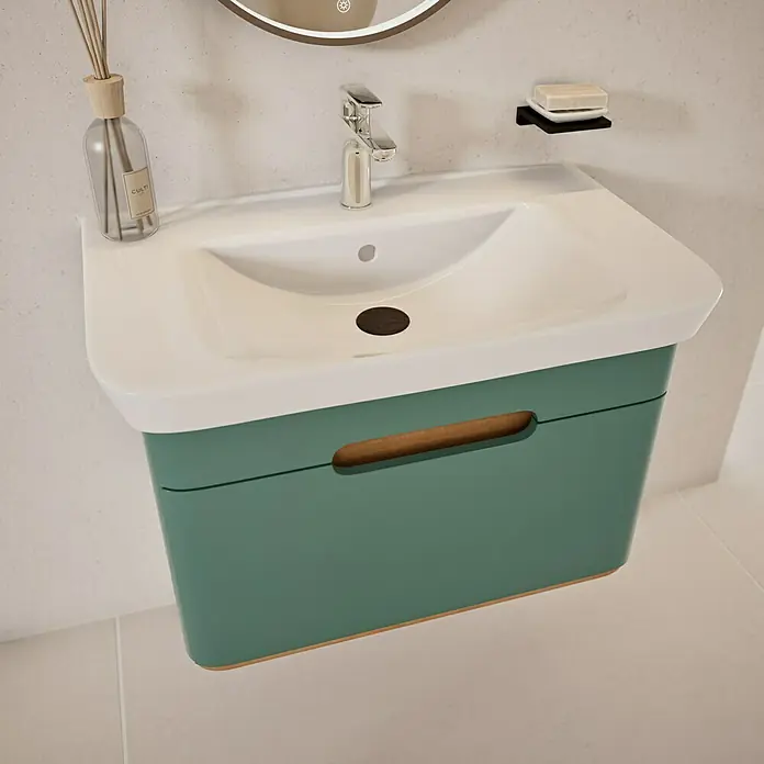 VitrA Sento Badmöbel-Set Sento - 80 cm, Fjordgrün, Griffmulde - Ein Waschbecken mit grünem Unterschrank, das ein modernes und stilvolles Badezimmerdesign präsentiert.