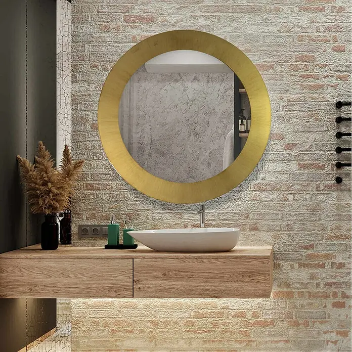 Espejo de pared Circular - Diámetro: 60 cm, Oro betún - Un punto focal: espejo redondo con marco dorado sobre un tocador moderno con cajones y lavabo sobre encimera en el baño.
