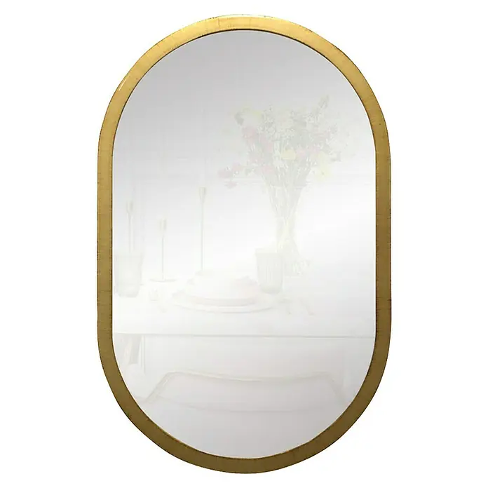 Espejo de pared Ovalado - 45 x 70 cm, Oro betún - Espejo ovalado con marco dorado que refleja una elegante mesa con flores y vajilla.