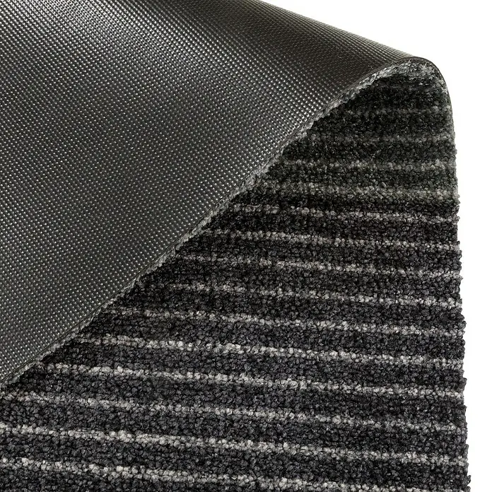 SCHÖNER WOHNEN-Kollektion Fußmatte Streifen - Anthrazit/Grau, 50 x 70 cm - Nahaufnahme einer schwarzen Fußmatte mit grauen Streifen und einer rutschfesten Unterseite.