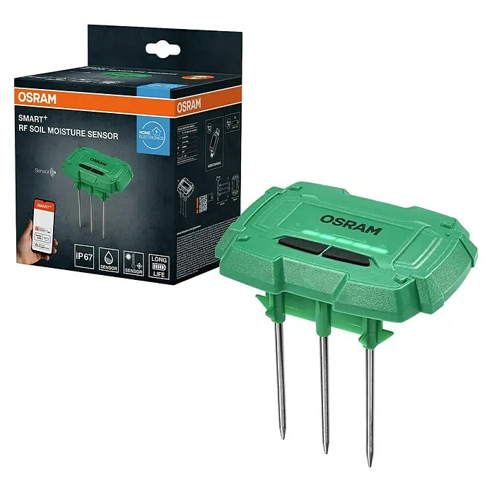 Osram Smart+ Bodenfeuchtesensor - Grün - Das Bild zeigt einen OSRAM SMART+ RF Bodenfeuchtigkeitssensor zusammen mit seiner Verpackung. Der Sensor ist grün und hat Metallstifte.