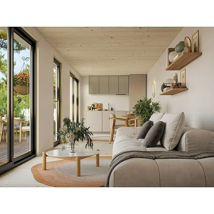 Palmako Gartenhaus Rebekka Nordic Plus - Außenmaß inkl. Dachüberstand (B x T): 901 x 339 cm, Holz, Natur unbehandelt - Helle Wohnungseinrichtung mit Sofa und Holztönen. Gemütliches Wohnzimmer mit Couch, Tisch und Aussicht ins Grüne für entspannte Stunden.