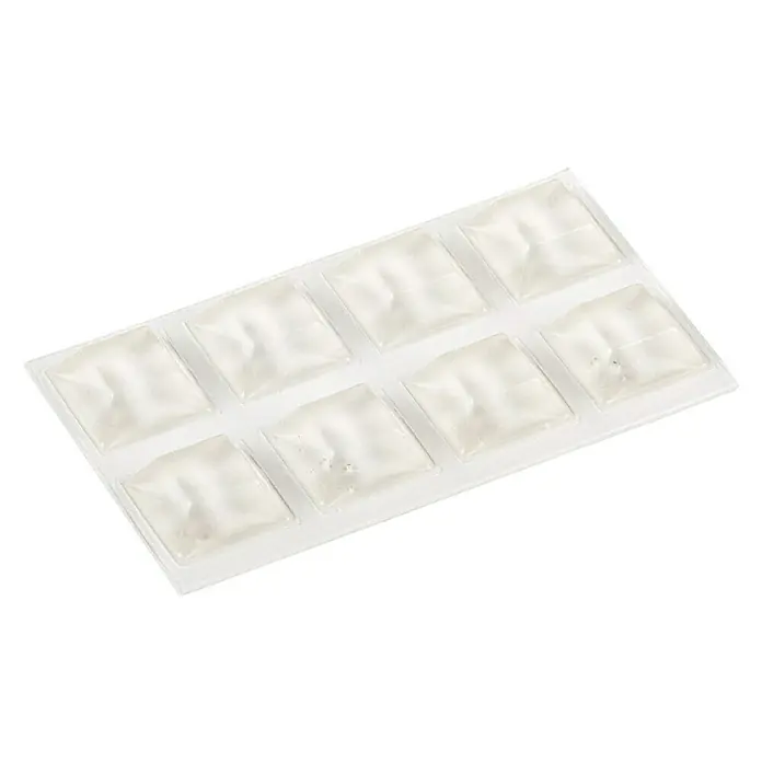 Stabilit Rutsch- & Lärmstopper - L x B: 20 x 20 mm, Transparent, Kleben, 8 Stk. - Ein Tablett mit acht Gel-Kühlakkus, die in Quadrate aufgeteilt sind und eine schnelle Kühlung ermöglichen, ideal für unterwegs oder zur lokalen Anwendung.