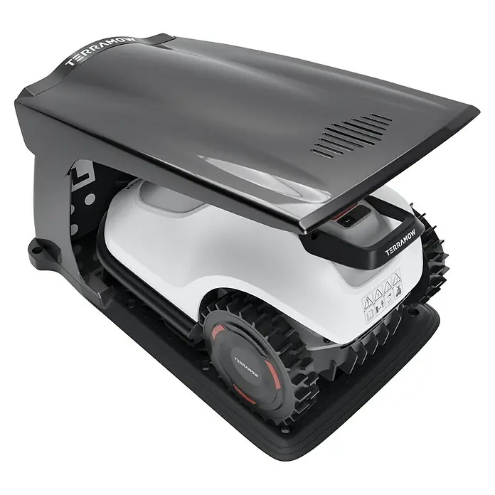 Terramow Mähroboter-Set V1000 inkl. Garage - 1.200 m², Schnittbreite: 20,3 cm, Kamera-gestützte Navigation - Der TerrAmow Mähroboter in seiner Ladestation, ein innovatives Gerät für die Rasenpflege.