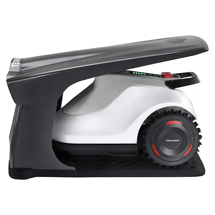 Terramow Mähroboter-Set V1000 inkl. Garage - 1.200 m², Schnittbreite: 20,3 cm, Kamera-gestützte Navigation - Nahaufnahme eines TerraMow-Robotermähers in seiner Ladestation, der modernes Design und Funktionalität vereint.