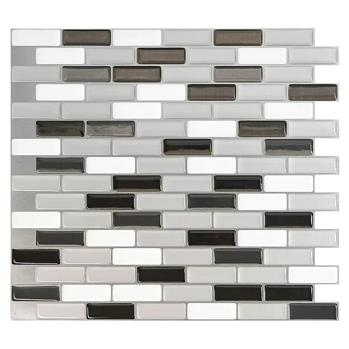 Smart Tiles Selbstklebemosaik Murano - 25,92 x 23,11 cm, Metallic, Glänzend - Nahaufnahme eines Paneels mit selbstklebenden Wandfliesen. Die Fliesen sind rechteckig und in Weiß, Grau und Dunkelgrau gehalten.