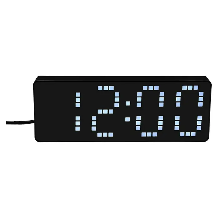 Versa Reloj despertador digital - An x Al: 5 x 6,2 cm, Negro - Primer plano de un reloj digital que muestra las 12:00. El reloj tiene un diseño minimalista y negro con números LED azul claro.