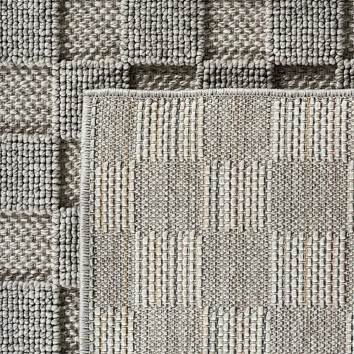 Flachgewebeteppich Helix 2203 - Silber, Durchmesser: 200 cm, 100 % Polyester - Detailaufnahme eines beigefarbenen Teppichs mit dezentem Muster, der eine warme und einladende Atmosphäre schafft.\n