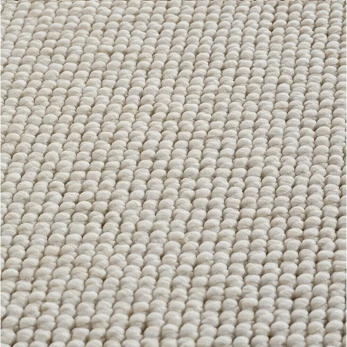 Flachgewebeteppich Helix 2200 - Creme, Durchmesser: 160 cm, 100 % Polyester - Detailaufnahme eines beigen Teppichs mit dichter, noppenartiger Textur, die eine weiche und einladende Oberfläche zeigt.