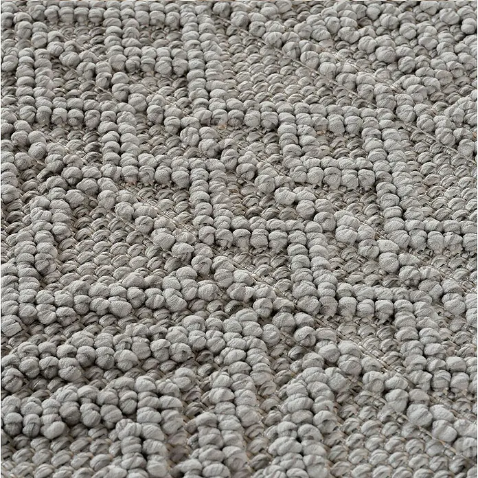 Flachgewebeteppich Helix 2202 - Silber, Durchmesser: 120 cm, 100 % Polyester - Nahaufnahme eines grauen Teppichs mit einer Textur aus kleinen, runden Schlaufen, die eine interessante Oberfläche bilden.