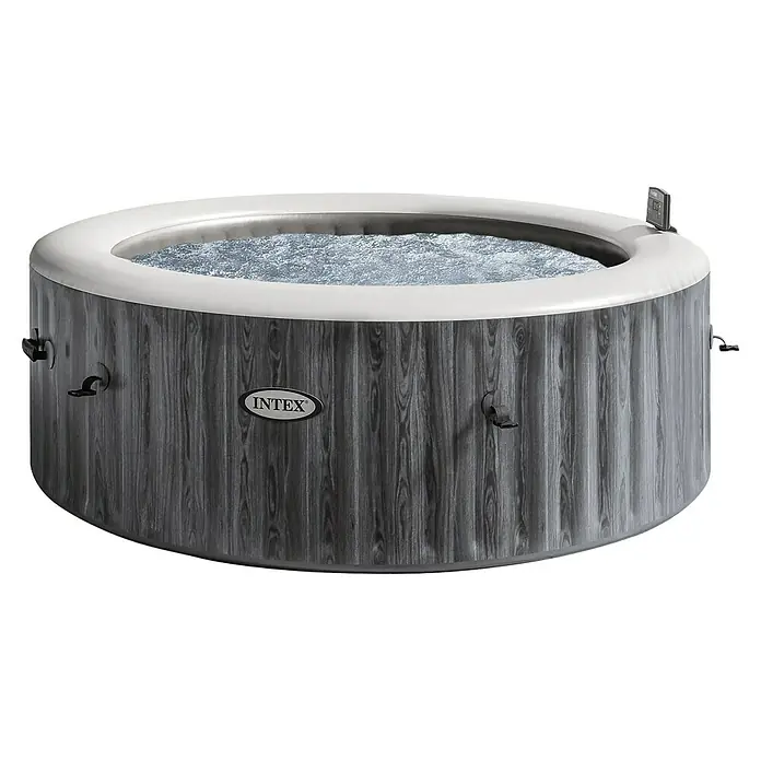 Intex Pure Spa Hidromasaje móvil Greenwood - Ø x Al: 216 x 71 cm, Gris/Blanco, 1.098 l - Imagen de un jacuzzi Intex con un diseño de grano de madera gris y un borde blanco, lleno de agua burbujeante, con control integrado.