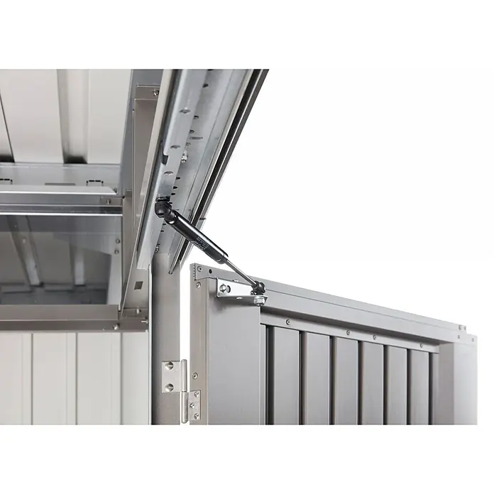 Biohort AvantGarde Gerätehaus A6 - Außenmaß inkl. Dachüberstand (B x T): 260 x 260 cm, Stahl, Quarzgrau Metallic, Doppeltür - Gasdruckfeder stützt den geöffneten Deckel einer grauen Metall-Aufbewahrungsbox.