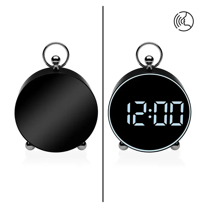 Versa Reloj despertador digital - An x Al: 4 x 13,3 cm, Negro - Despertador digital negro con pantalla redonda, apagado y encendido mostrando 12:00. Con aro superior e icono de control por voz.