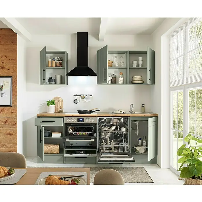 Respekta Küchenzeile Anton Typ 1 - Breite: 220 cm, Schilfgrün, Mit Elektrogeräten - Moderne hellgrüne Küche mit Holztheken, schwarzer Dunstabzugshaube und offenem Backofen und Geschirrspüler, funktionales Design.
