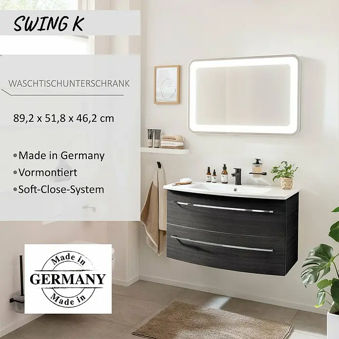 Camargue Swing K Waschtischunterschrank - B x T x H: 89,2 x 46,2 x 51,8 cm, Dark Oak, Farbe Griff: Chrom - Dunkelgrauer wandmontierter Waschtischunterschrank mit Waschbecken, Spiegel. Text-Overlay: 'SWING K WASCHTISCHUNTERSCHRANK', Maße, 'Made in Germany'.