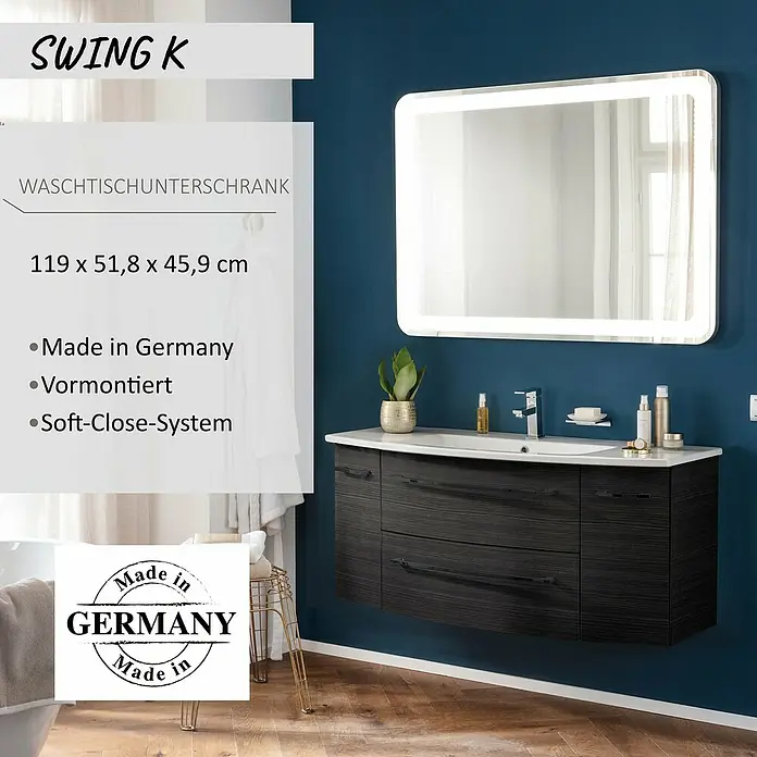 Camargue Swing K Waschtischunterschrank - 119 x 46 x 52 cm, Dark Oak - Dunkler Waschtischunterschrank mit weißem Waschbecken und beleuchtetem Spiegel an einer blauen Wand.