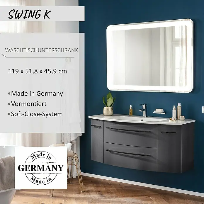 Camargue Swing K Waschtischunterschrank - 119 x 46 x 52 cm, Grafit - Anthrazitfarbener Waschtischunterschrank mit integriertem Waschbecken und weißer Arbeitsplatte, in einem modernen Bad unter einem beleuchteten Spiegel.
