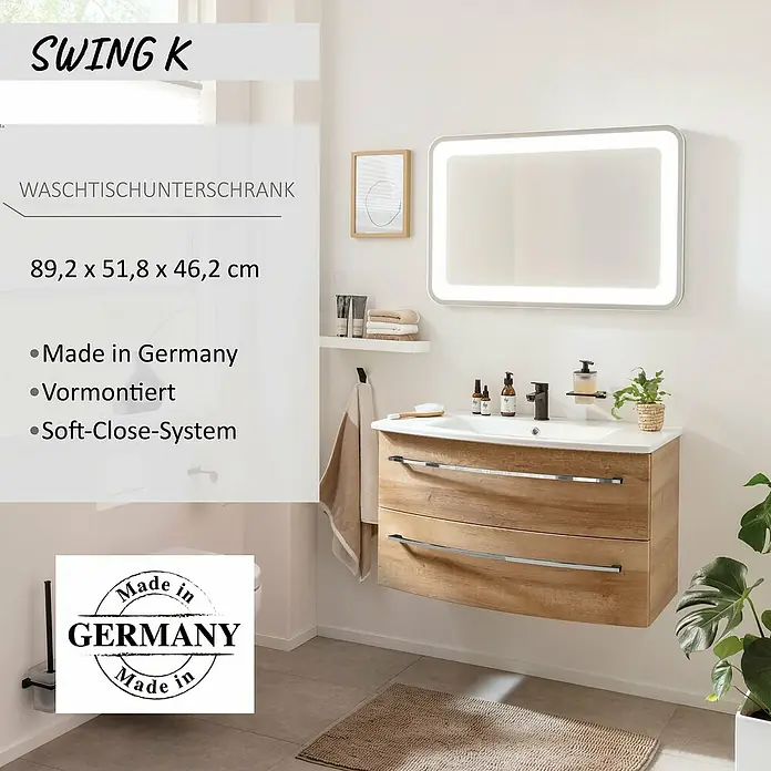 Camargue Swing K Waschtischunterschrank - B x T x H: 89,2 x 46,2 x 51,8 cm, Berg Eiche, Farbe Griff: Chrom - Hölzerner Waschtischunterschrank mit weißem Waschbecken, Chromgriffen und beleuchtetem Spiegel im Bad.