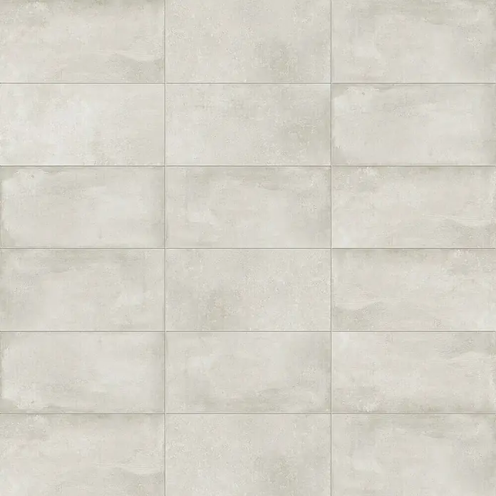 DryTile Feinsteinzeugfliese Studio Lime - 30 x 60 cm, Beige, Matt - Helle beigefarbene rechteckige Fliesen in Betonoptik mit dezenter Textur, in einem Gittermuster angeordnet.