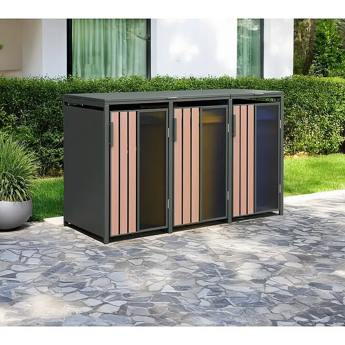 Mülltonnenbox - Stahl, Anthrazit, Geeignet für Anzahl Mülltonnen: 3 Stk. - Dunkelgraue Outdoor-Aufbewahrungseinheit mit drei Fächern, Holzoptik- und durchscheinenden Paneelen, auf einer Steinterrasse inmitten von Grün.