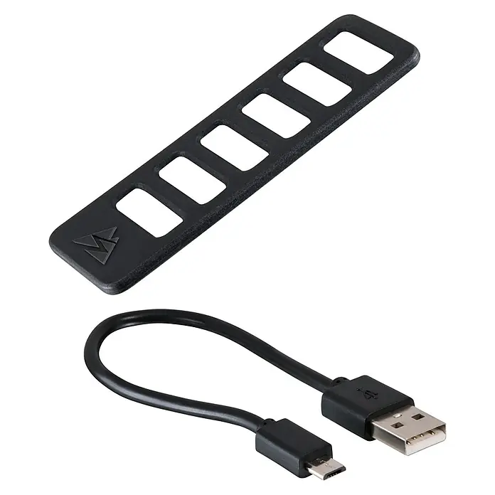 Sigma Dynamo-LED-Rücklicht Blaze - Ohne Batterien - Zwei schwarze Accessoires: eine perforierte Platte mit Logo und ein USB-A zu Micro-USB-Kabel.