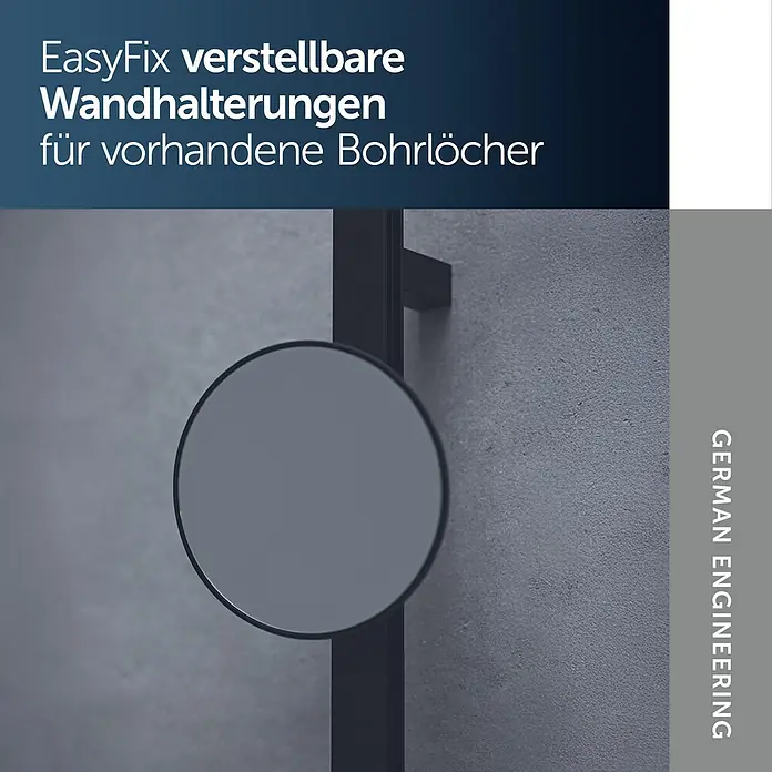 Ideal Standard Kosmetikspiegel Beauty Bar - 31 x 71,7 cm, Durchmesser: 20,5 cm, Rund, Schwarz - Dunkelgraue, runde verstellbare Dusch-Wandhalterung an grauer Betonwand.