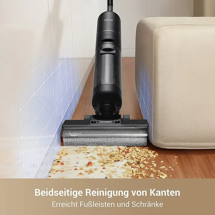 Dreame Akku-Nass-Trockensauger G10 Pro - Saugkraft: 16.000 Pa, Akkulaufzeit: 35 min, Wassertankvolumen: 0,9 l - Schwarzer Dreame Nass-/Trockensauger mit grauer Bürste reinigt verschüttetes Müsli und Milch auf Holzfußboden, demonstriert Kantenreinigung.