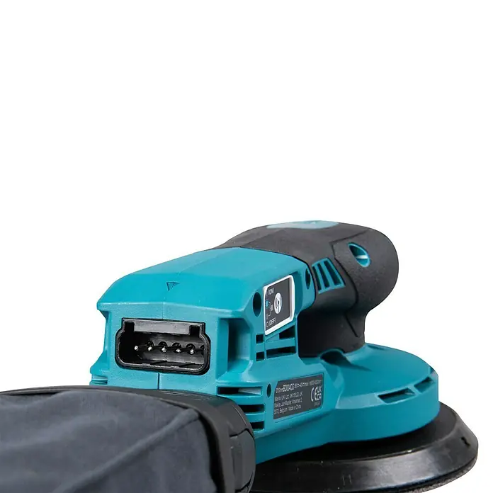 Makita XGT 40V max. Akku-Exzenterschleifer BO004CGZ - 40 V, Ohne Akku, Durchmesser Schleifteller: 150 mm - Türkis-schwarzer Akku-Exzenterschleifer mit angeschlossenem Staubfangbeutel, zeigt den Stromeingang und einen Ein/Aus-Schalter.