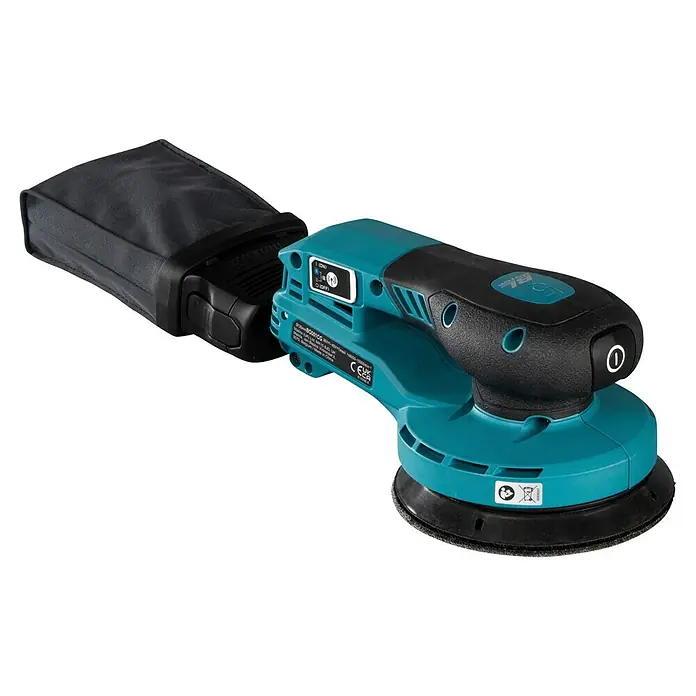 Makita XGT 40V max. Lijadora excéntrica de batería BO001CG -  - Lijadora roto-orbital eléctrica turquesa y negra con bolsa de polvo acoplada, vista desde arriba.