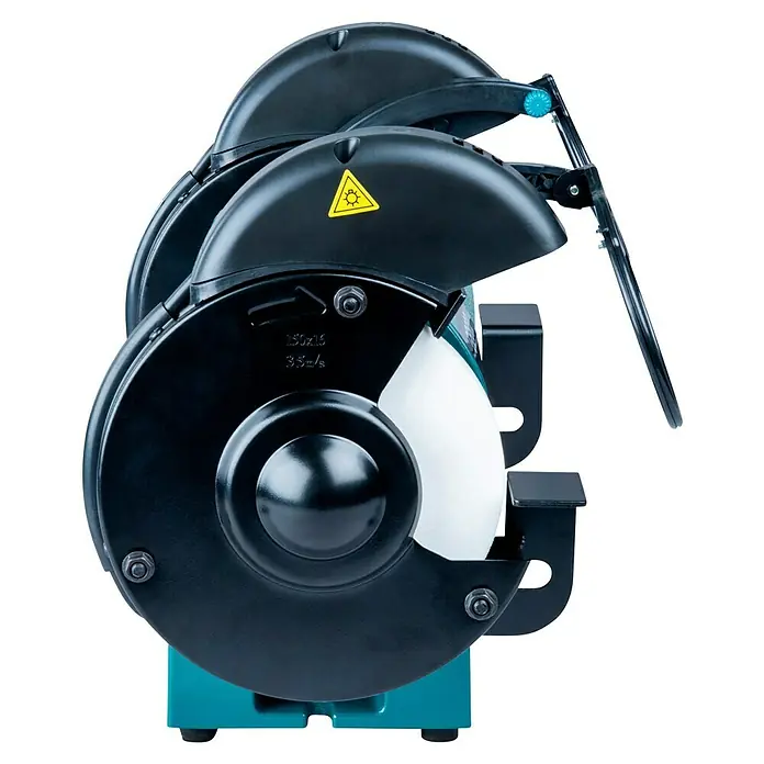 Makita Elektro-Doppelschleifer GB602 - 250 W, 2.850 U/min - Eine Doppelschleifmaschine mit schwarzen Metallabdeckungen, türkisfarbener Basis, weißer Schleifscheibe und transparentem Schutzschild mit gelbem Warnaufkleber.